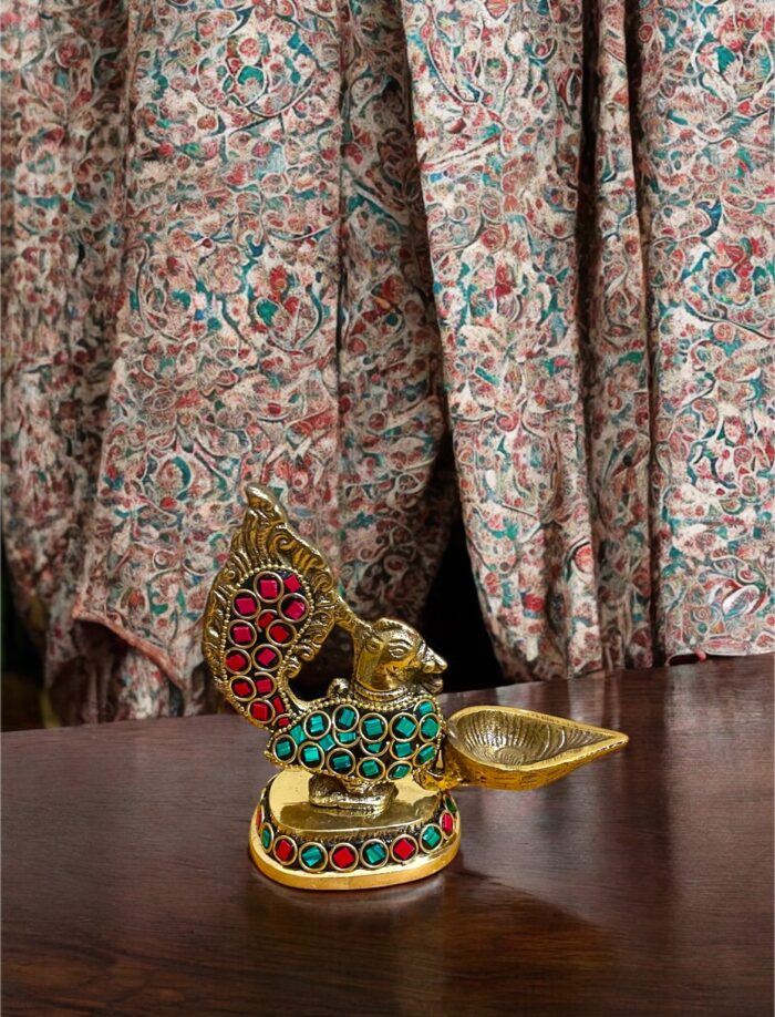 img_4925 স্টোনের কাজ করা ঐতিহ্যবাহী পিতলের ময়ূর প্রদীপ – পূজা, হোম ডেকোর ও উপহার দেওয়ার জন্য একেবারে আদর্শ - Image 1