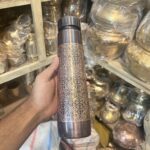 Antique-style engraved pure copper water bottle with Advanced Leak Proof Protection, Ayurveda and Yoga Health Benefits - 900 ml